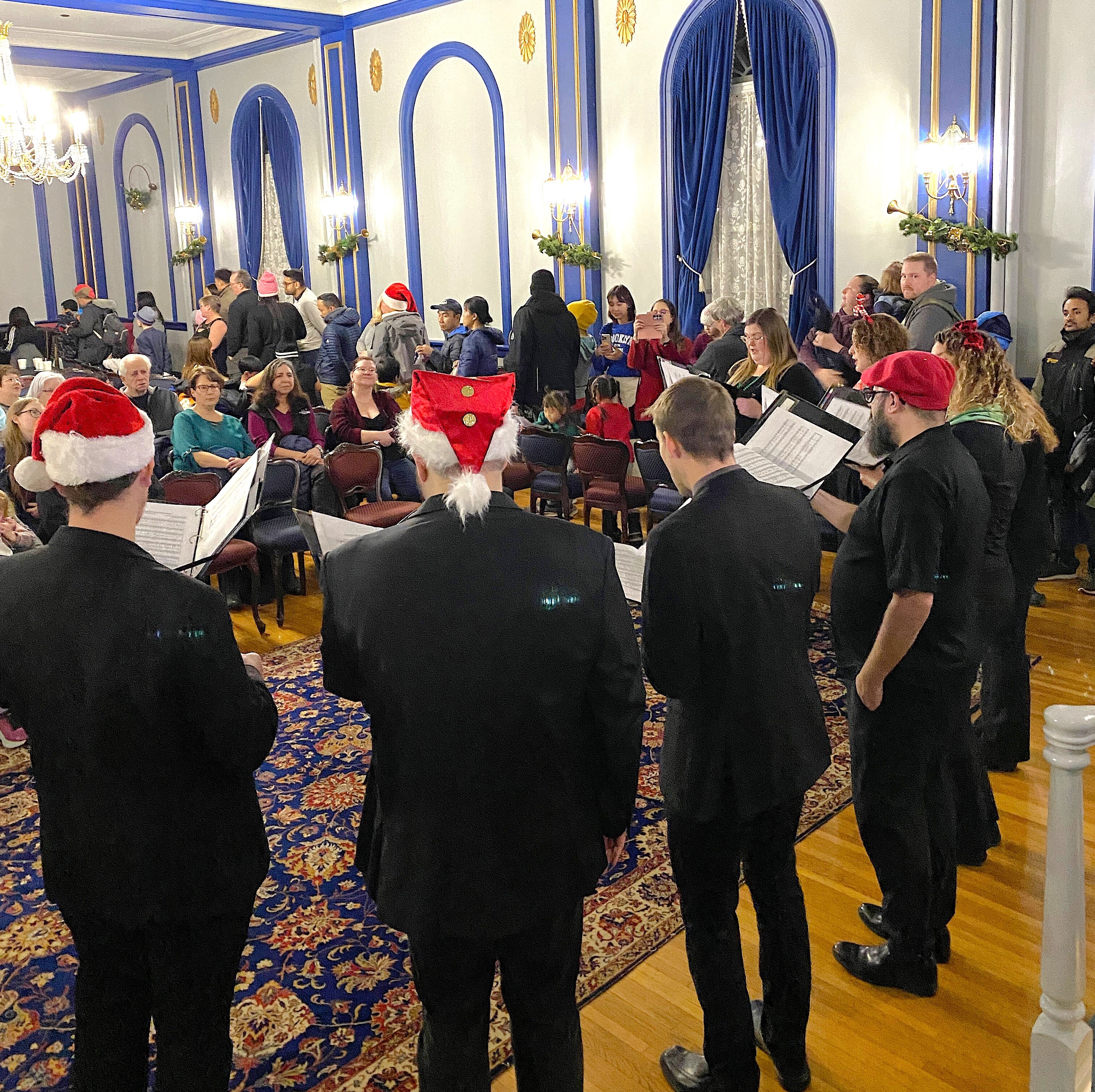 Wascana Voices, a choral ensemble sing Christmas songs in the ballroom of Government House Saskatchewan