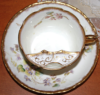 Moustache tea cup that can be found in the second guest bedroom of the museum in Government House SK