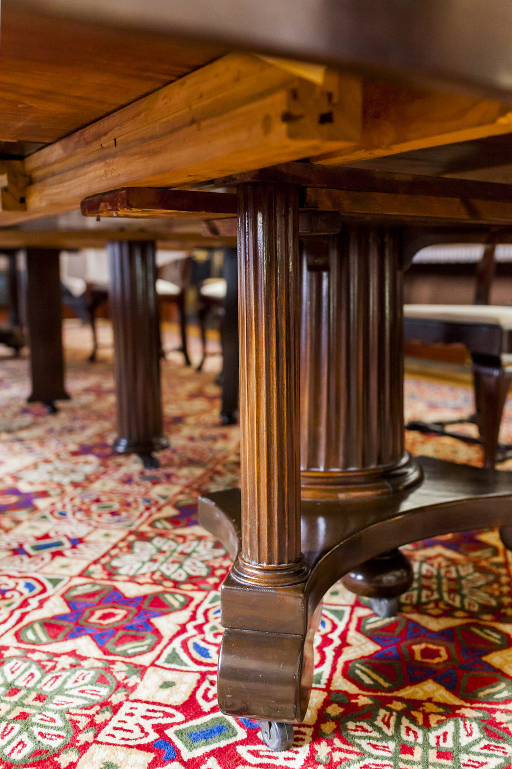 The legs of the dining room table located in the museum of Government House Saskatchewan