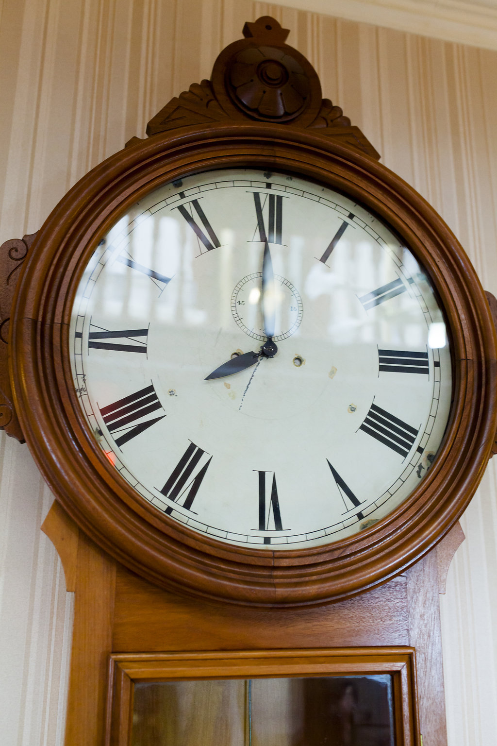 The face of a wooden clock that is originally to Government House Saskatchewan  (1891)