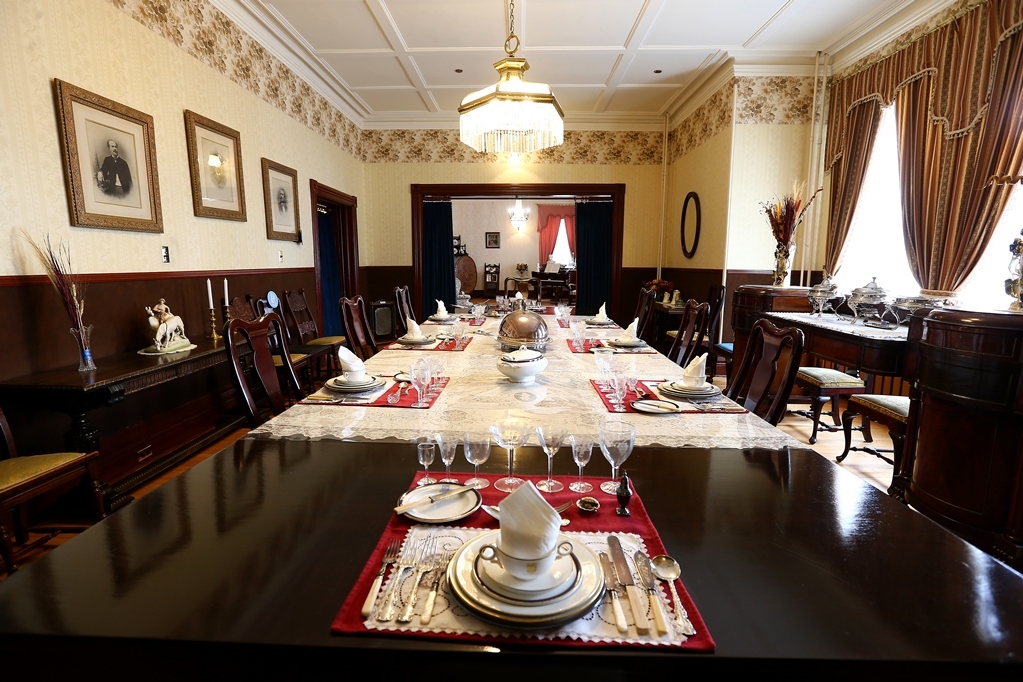 A dining room table in the dining room of the museum at Government House Saskatchewan