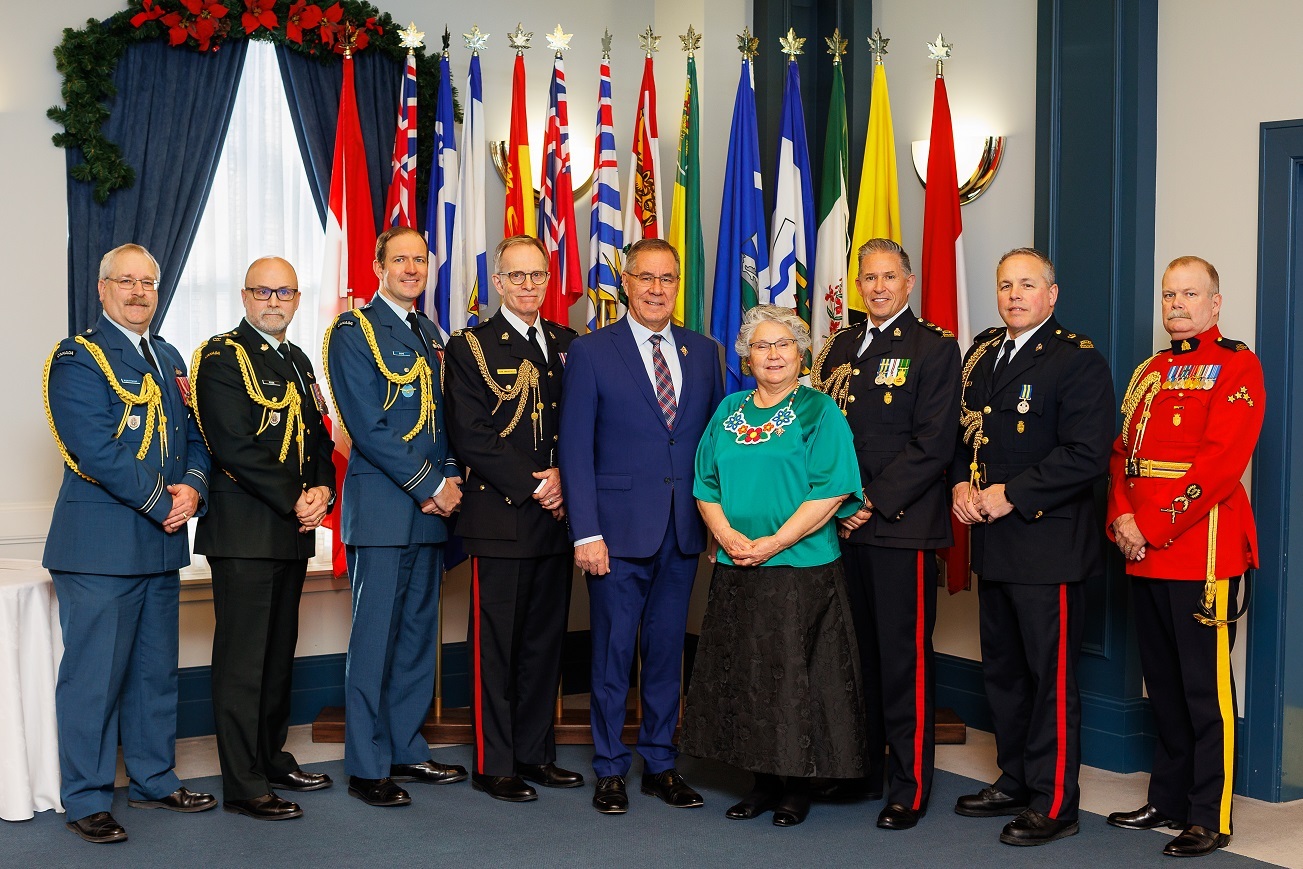 The Lieutenant Governor of Saskatchewan and his wife standing with men in military and RCMP uniforms at the New Years Day Levee 2020