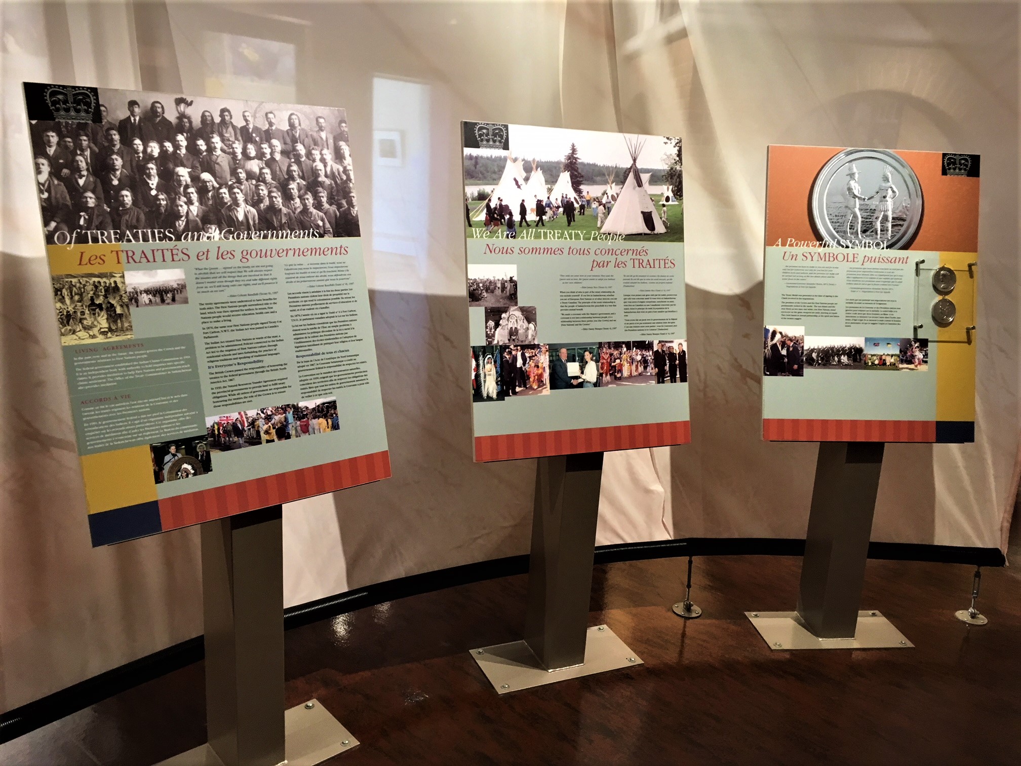 Main exhibit space of the interpretive centre displaying three posters talking about the treaties between the indigenous peoples and settlers of Canada.