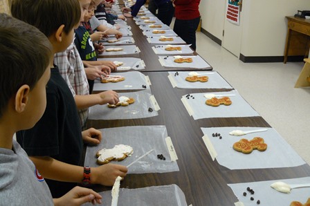 School group decorating gingerbread cookies.