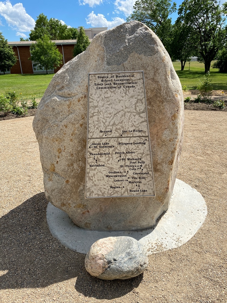 Saskatchewan Residential School Memorial boulder that has a map of the Saskatchewan Residential Schools locations on it.