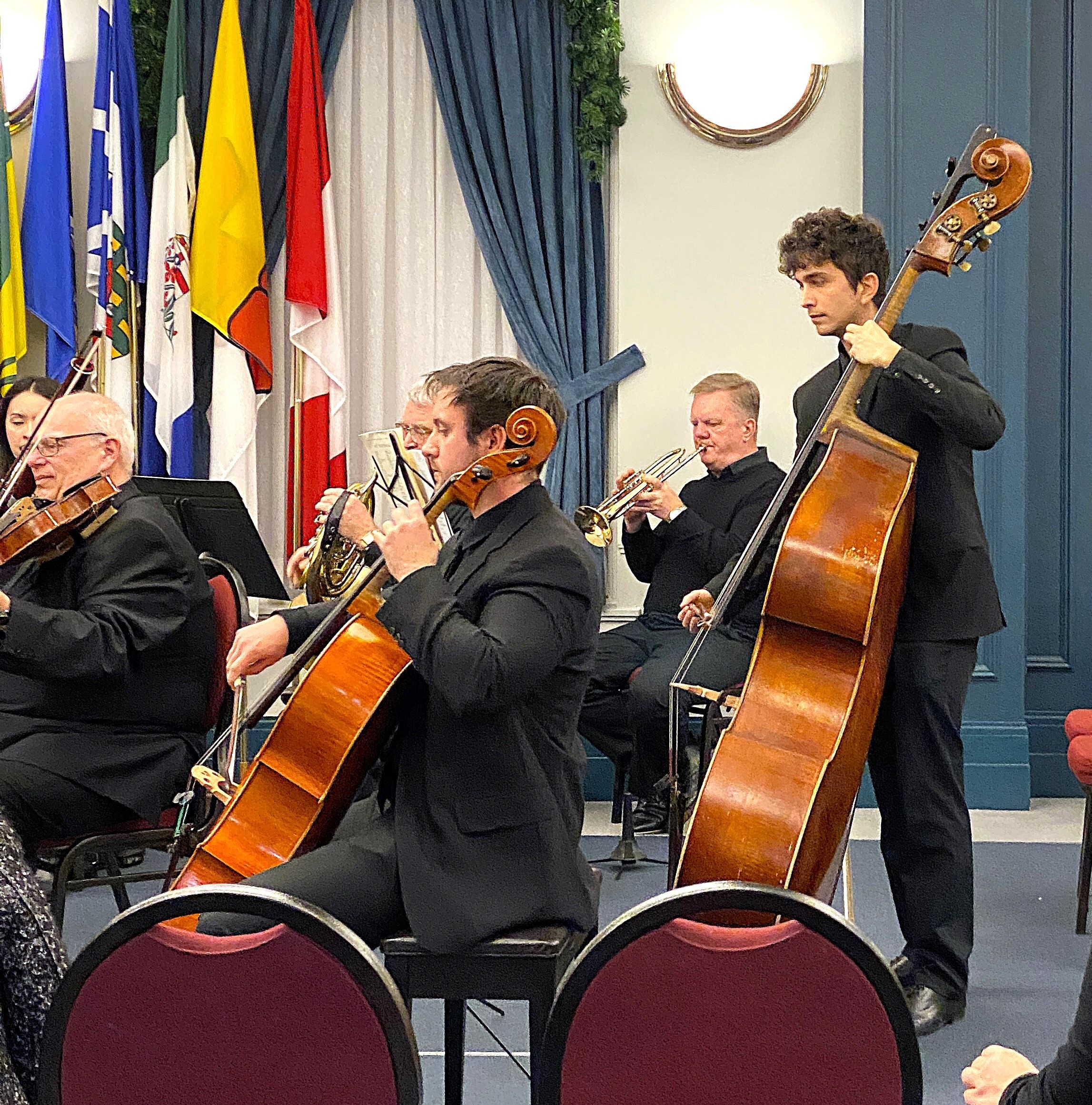 Regina Sympathy Orchestra chamber musicians playing Christmas music in Sir Richard Lake Hall in Government House Saskatchewan